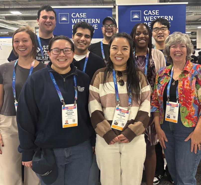 A group of nine CWRU attendees pose at the Consumer Technology Association trade show.