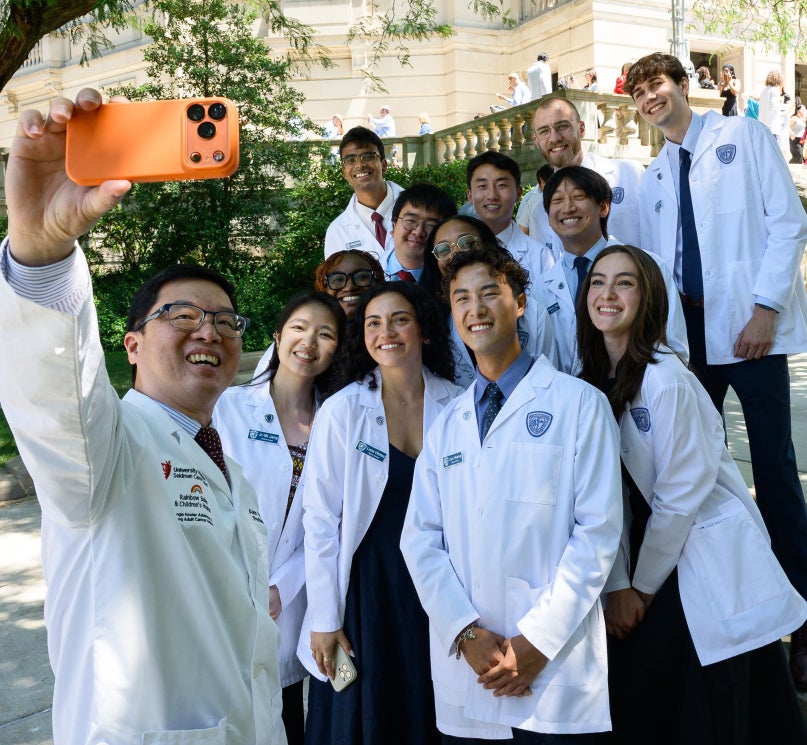 A group of incoming medical school students pose for a selfie at the Case Western Reserve University White Coat Ceremony.