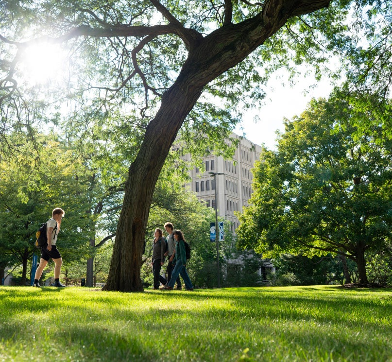 CWRU students walking through Case Quad on a sunny day.
