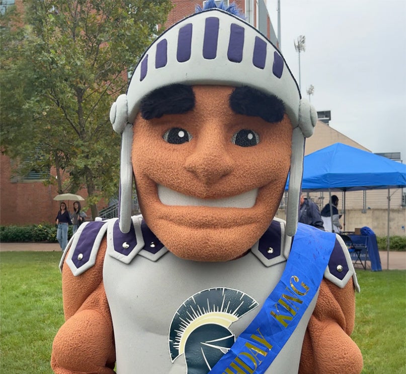 CWRU’s Spartan mascot Spartie wearing a birthday sash.