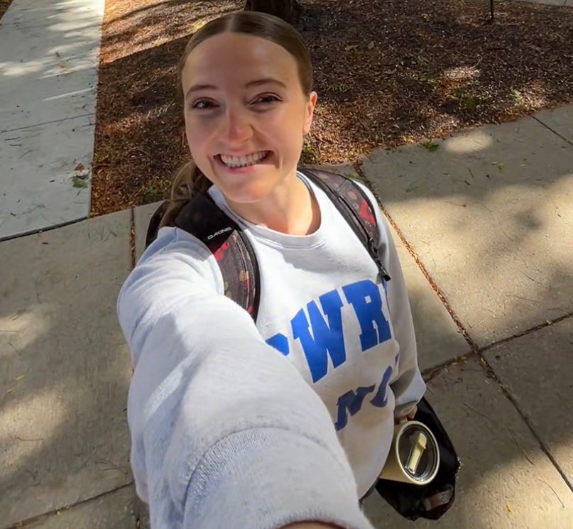 CWRU student Baylee Van Patten holding her phone out for a selfie video.