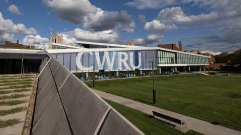 Photo of Tinkham Veale University Center on a sunny day with CWRU signage on the windows
