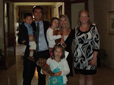 Photo of the Nicole Parker with the McLaughlin family at the time of Quinn's adoption 
