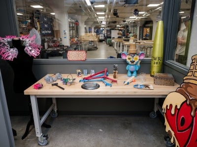 Table with various painted items at the Sherwin-Williams Paint & Coatings Studio, located at Sears think[box]. 