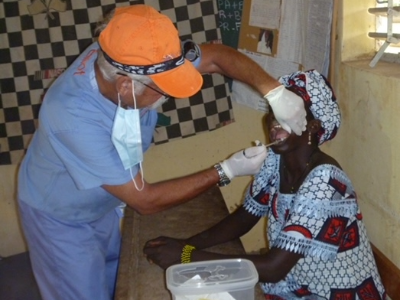 Siegel providing dental care to an African Woman 