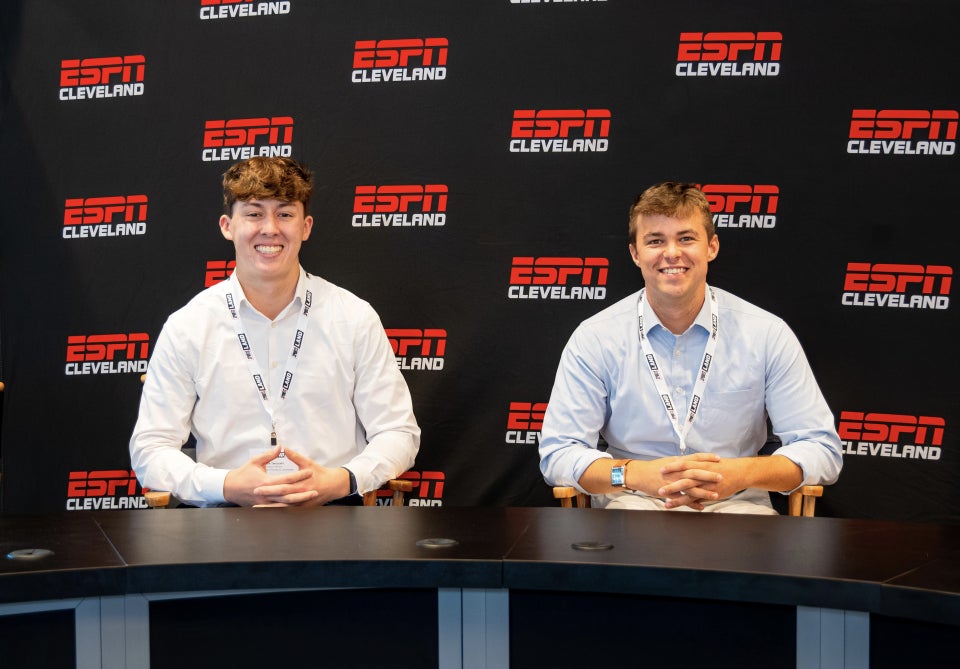 CWRU students Mark Takasaki and Charles Griffith pose at ESPN Cleveland's SportsLand Summit