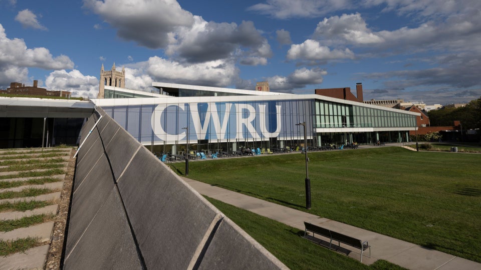 Photo of Tinkham Veale University Center on a sunny day with CWRU signage on the windows