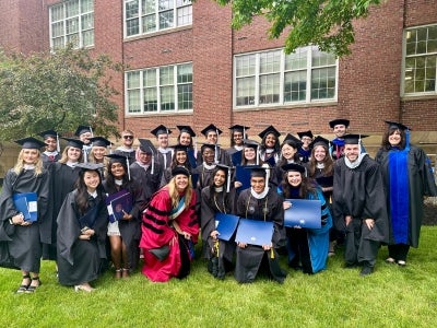 Eileen Anderson celebrates commencement with graduate students part of the Bioethics and Medical Humanities program. 