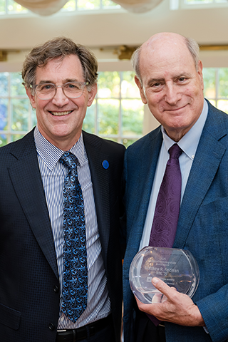 Bruce Feldman posing with his Distinguished Undergraduate Alumni Award