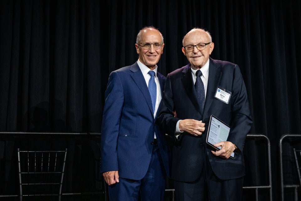 Michel accepting award from Dean Gerson