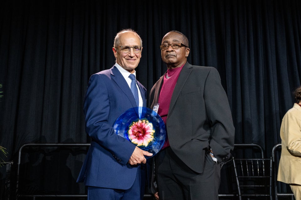 Burney accepting award from Dean Gerson