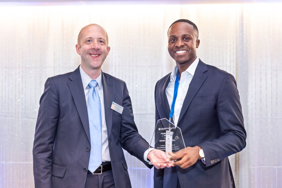 Case Western Reserve University alumni Nicholas Zalany and Kevin Russell pose with an alumni award
