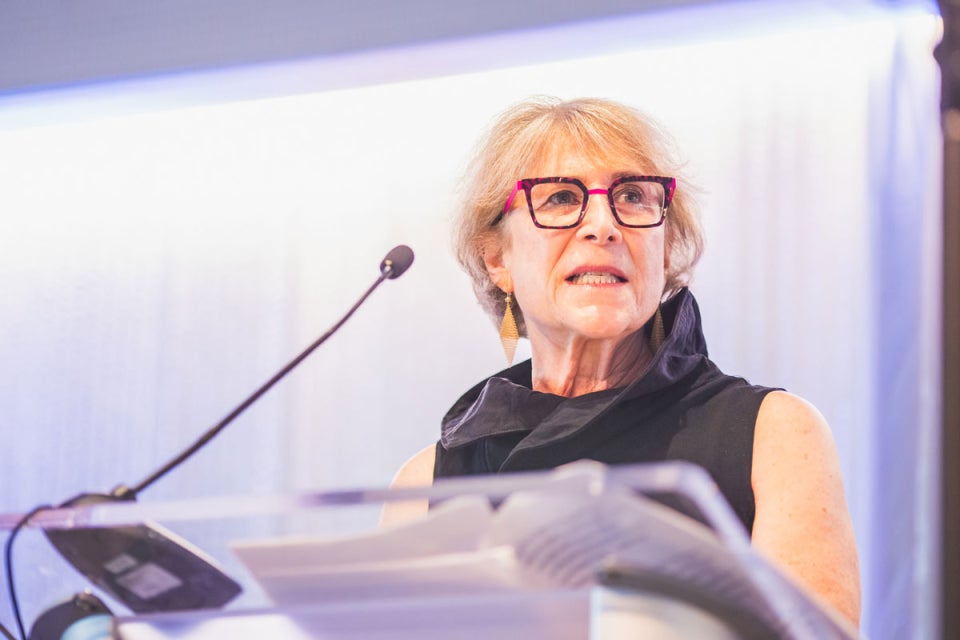 Case Western Reserve University alumni Judy Strauss-Schwartz speaks at a podium