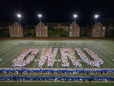 Photo taken from above as the Class of 2029 spells out CWRU on DiSanto Field during Discover Week 