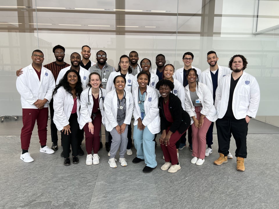 Brock Montgomery posing with fellow medical students