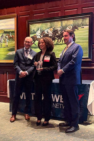 Photo of Andrea Silva accepting her 2026 20 Twenties class by Aviation Week award