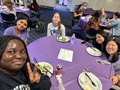 Photo of members of WISER around a table
