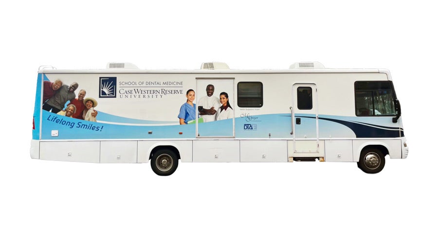Mobile dental clinic vehicle from Case Western Reserve University's School of Dental Medicine, featuring healthcare professionals and smiling seniors.