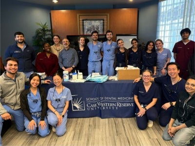 Andrew Jacunski (pictured center) and other School of Dental Medicine students at Case Western Reserve University.  