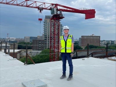 Rooftop view of Andrew Froelich at the ISEB construction site. 