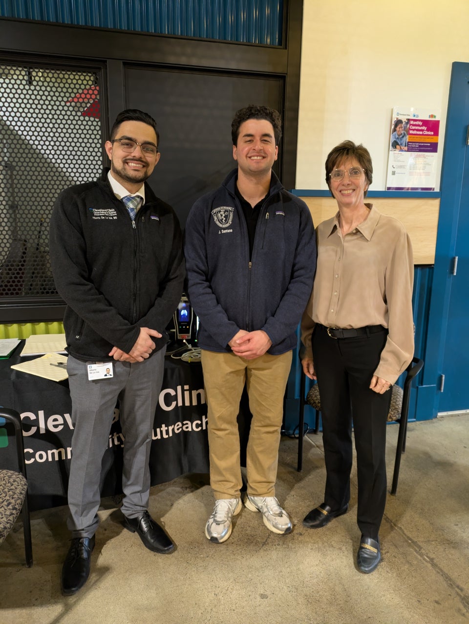 Alberto De La Isla, Jose Santana, and Monica Yepes-Rios smiling together at CentroVilla25 health talk and screening program
