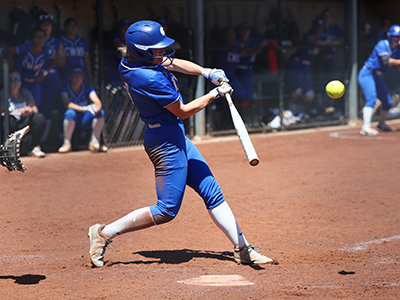Photo of Elizabeth Berry hitting a softball