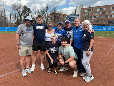 Photo of Elizabeth Berry and group on the softball field