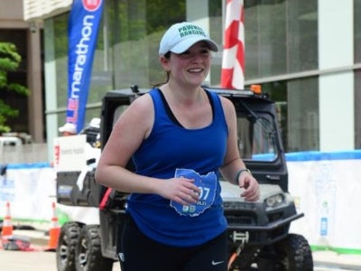 Meg Herrel runs in a marathon