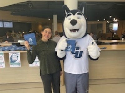 Lysette Roman with JCU wolf mascot