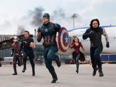 Captain America and other Avengers run in a movie scene