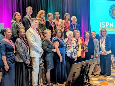 Jaclene Zauszniewski (pictured top left) and other fellows of the fellow of the International Society of Psychiatric Mental Health Nurses. 