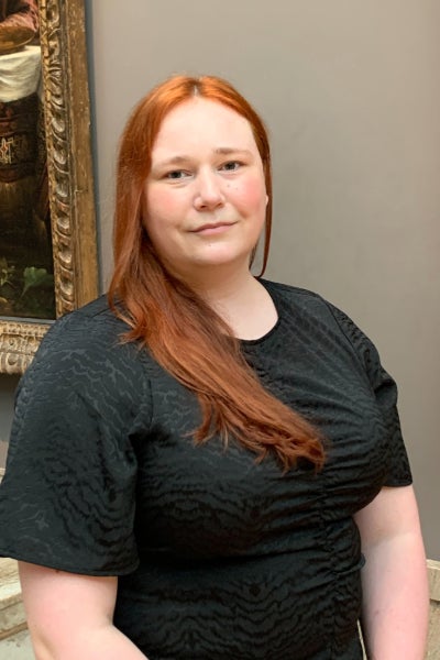 Claire Sumner standing inside an art gallery