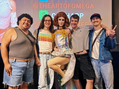 Omie Meza (pictured left) attends a drag trivia event with friends. 
