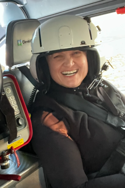 Raquel Dauch smiles in a helicopter