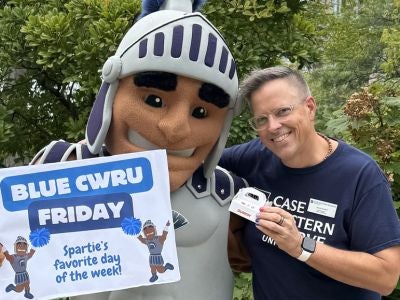 Jason Steckel promotes Blue CWRU Friday with Spartie. 