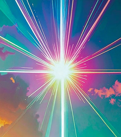 A colorful starburst pattern with multicolored beams emanating from a bright white center against a cloud-filled background.