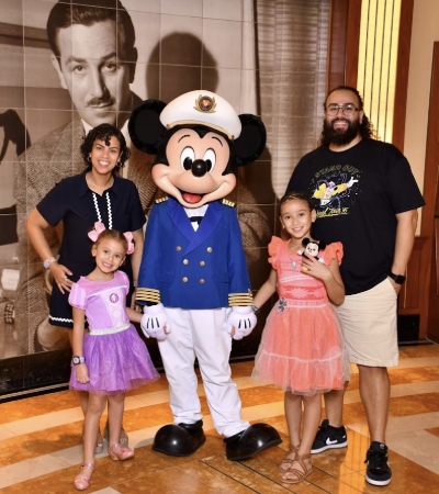 Juan Silva poses with his family with Mickey Mouse.