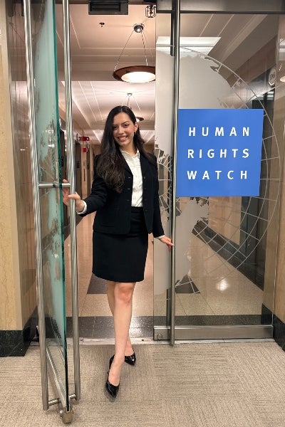Anna Styer at the office door of Human Rights Watch in NYC