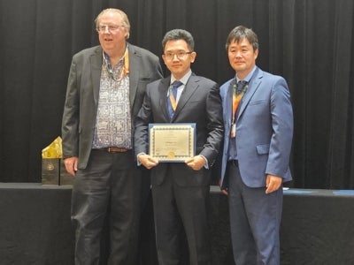 Chengyu Li takes a group photo after receiving the Fluids Engineering Division Summer Meeting Rising Star (FEDSM) Award 