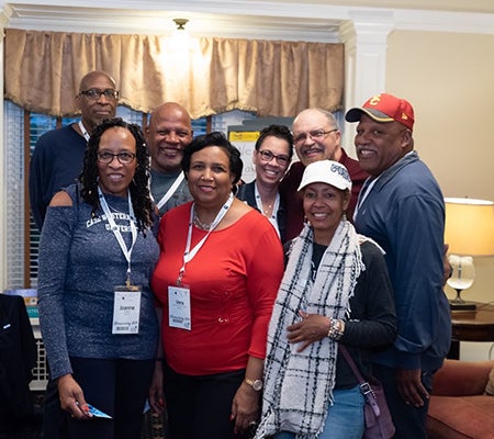Group of alumni pose at CWRU alumni event