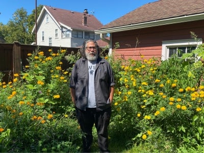 Esteban Vazquez-Hidalgo in his garden of cempasúchiles. 
