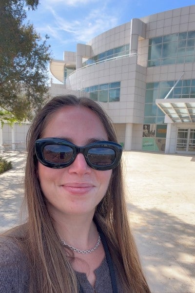Clara Pinchbeck standing in front of the Getty Research Institute