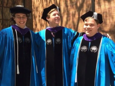 Liam Dunn (left) and CWRU law faculty at commencement. 