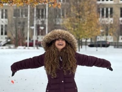 Carlene Ledsma plays in the snow