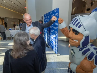 Andrew Medvedev (left) and Spartie pound at the 2026 Dean's welcome event at Weatherhead School of Management