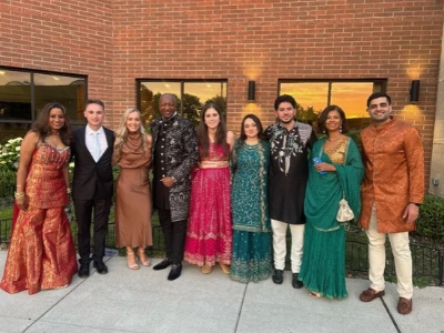 Andre Mickel, his wife and CWRU endodontic students pose in traditional Indian attire at a resident’s wedding.