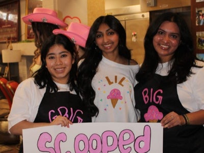 Mia Osborne (left) with other members of Alpha Gamma Delta International Fraternity