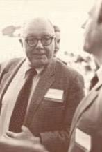 Jack Caughey speaking to someone at an event