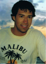 Jason Madachy wearing a yellow tshirt with the words Malibu