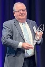 Alex Wallach receiving an award